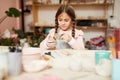 Cute Little Girl Shaping Clay Royalty Free Stock Photo