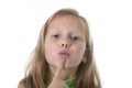 Cute little girl showing her lips in body parts learning school chart serie Royalty Free Stock Photo