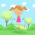 Cute little girl skipping rope in park Royalty Free Stock Photo