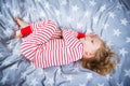 Cute little girl sleeps in pajames on bed Royalty Free Stock Photo