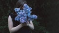 Cute little girl smelling lilac Royalty Free Stock Photo