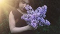 Cute little girl smelling lilac Royalty Free Stock Photo