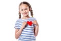 Cute little girl smiling and holding red decorative heart isolated on white background Royalty Free Stock Photo