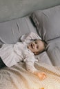 Cute little girl smilling on a bed Royalty Free Stock Photo