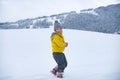 Cute little girl on snow winter nature. Funny kid in winter clothes. Children play outdoors in snow. Kids Christmas Royalty Free Stock Photo