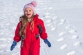 Cute little girl on snow winter nature. Funny kid in winter clothes. Children play outdoors in snow. Kids Christmas Royalty Free Stock Photo