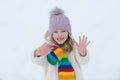 Cute little girl on snow winter nature. Funny kid in winter clothes. Children play outdoors in snow. Kids Christmas Royalty Free Stock Photo