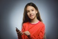 Cute little girl speaking on the cell phone. isolated on gray Royalty Free Stock Photo