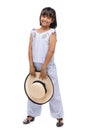 Cute little girl standing in swimming wear and hat on white background Royalty Free Stock Photo