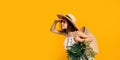 Cute little girl in straw hat in sunglasses holds handbag with tropical plants looking something Royalty Free Stock Photo