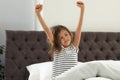 Cute little girl stretching after sleep Royalty Free Stock Photo