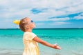 Beautiful little girl at beach having fun. Funny girl enjoy summer vacation. Royalty Free Stock Photo