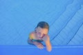 Cute little girl in the swimming pool. Portrait of little cute girl in the swimming pool. Sunny summer day. Summer and happy chil Royalty Free Stock Photo