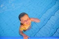 Cute little girl in the swimming pool. Portrait of little cute girl in the swimming pool. Sunny summer day. Summer and hap Royalty Free Stock Photo