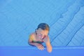 Cute little girl in the swimming pool. Portrait of little cute girl in the swimming pool. Sunny summer day. Summer and happy chil Royalty Free Stock Photo