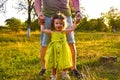 Cute little girl take hands with her father. Walking with kids concept image. Little girl holding hands with her parents. Smiling Royalty Free Stock Photo