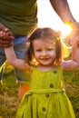 Cute little girl take hands with her father. Walking with kids concept image. Little girl holding hands with her parents. Smiling Royalty Free Stock Photo