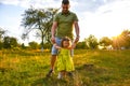 Cute little girl take hands with her father. Walking with kids concept image. Little girl holding hands with her parents. Smiling Royalty Free Stock Photo