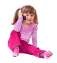 Cute little girl is talking on cell phone Royalty Free Stock Photo