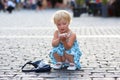 Cute little girl talking on mobile phone in the city Royalty Free Stock Photo