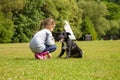 Girl training dog in park friendship Royalty Free Stock Photo