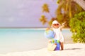 Cute little girl travel on summer beach