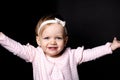 A cute little girl two years old over dark background Royalty Free Stock Photo