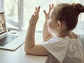 Cute little girl using laptop at home. Education, online study, home studying Kids distance learning Royalty Free Stock Photo