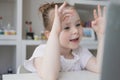 Cute little girl using laptop at home. Education, online study, home studying Kids distance learning Royalty Free Stock Photo