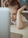 Cute little girl using laptop at home. Education, online study, home studying Kids distance learning Royalty Free Stock Photo