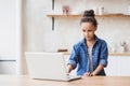 Cute little girl using laptop at home. Education, online studying, technology, distance learning, homework, schoolgirl children