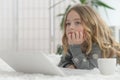 Cute little girl using laptop at home on floor Royalty Free Stock Photo
