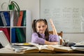 Cute little girl using laptop to study online at home. Royalty Free Stock Photo