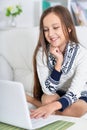 Portrait of little girl using modern laptop Royalty Free Stock Photo