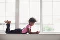 Cute little girl using smart phone at home. Student teenager texting on her mobile phone Royalty Free Stock Photo