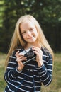 Cute little girl with a vintage rangefinder camera.