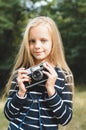 Cute little girl with a vintage rangefinder camera.