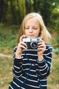 Cute little girl with a vintage rangefinder camera.