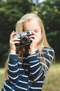 Cute little girl with a vintage rangefinder camera.