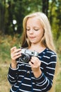 Cute little girl with a vintage rangefinder camera.