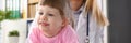 Cute little girl visiting family doctor office Royalty Free Stock Photo