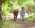 Cute Little Girl Walking Her Pony Royalty Free Stock Photo