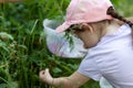 Cute little girl watering flowers in the garden. Selective focus Royalty Free Stock Photo