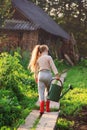 Cute little girl watering plants with watering can in garden. C Royalty Free Stock Photo