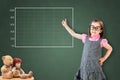 Cute little girl wearing business dress and showing on empty graph on green chalk board.