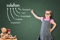 Cute little girl wearing business dress and showing solution finding method on green chalk board.