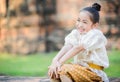 Cute little girl wearing typical thai dress and smile