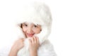 Cute little girl wearing a white fur coat and hat Royalty Free Stock Photo