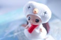 Cute little girl wearing white hat and red scarf like a snowman preparing for christmas in winter Royalty Free Stock Photo