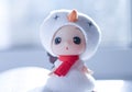 Cute little girl wearing white hat and red scarf like a snowman in winter Royalty Free Stock Photo